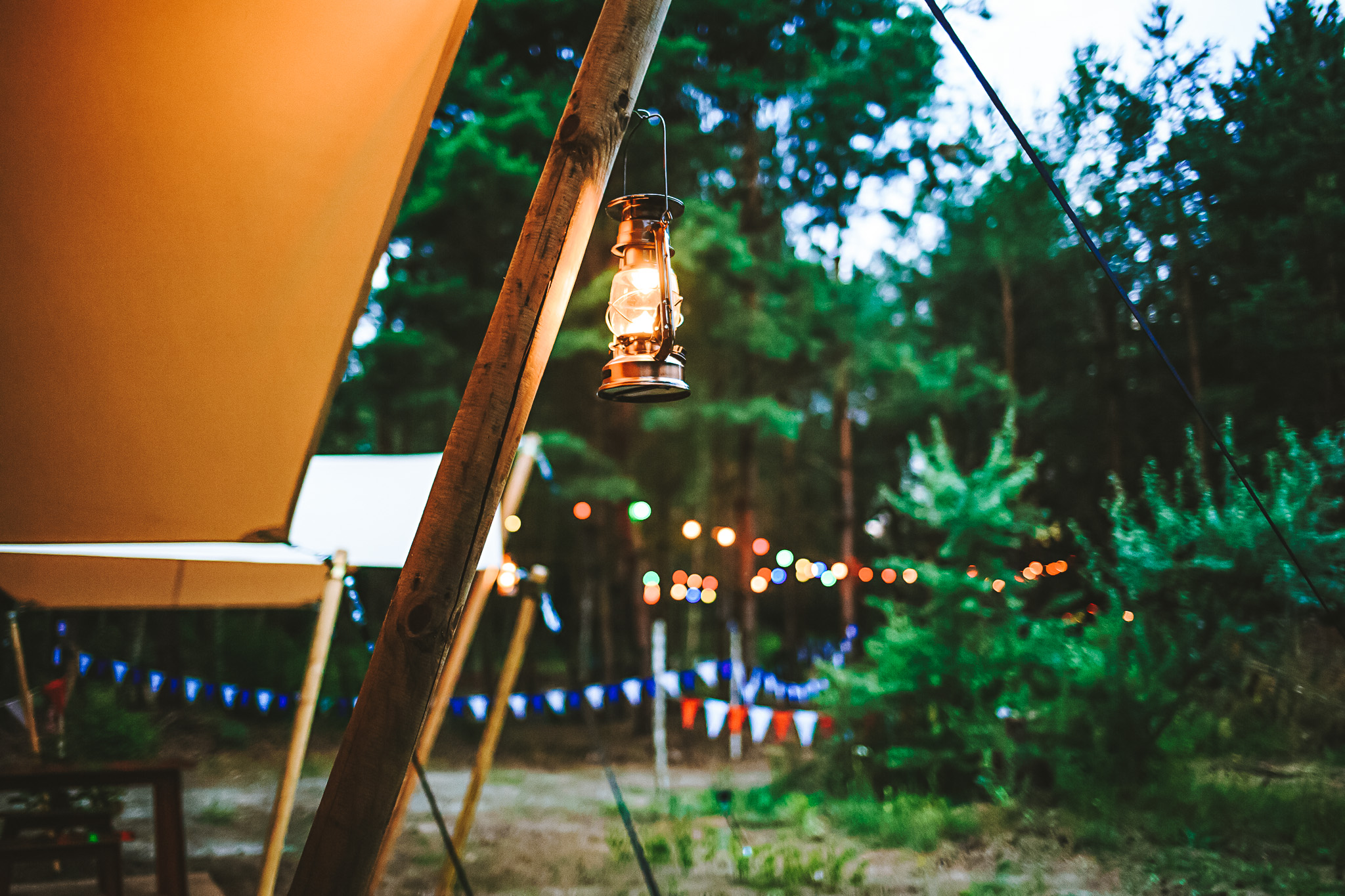 lamp hanging on wooden pole